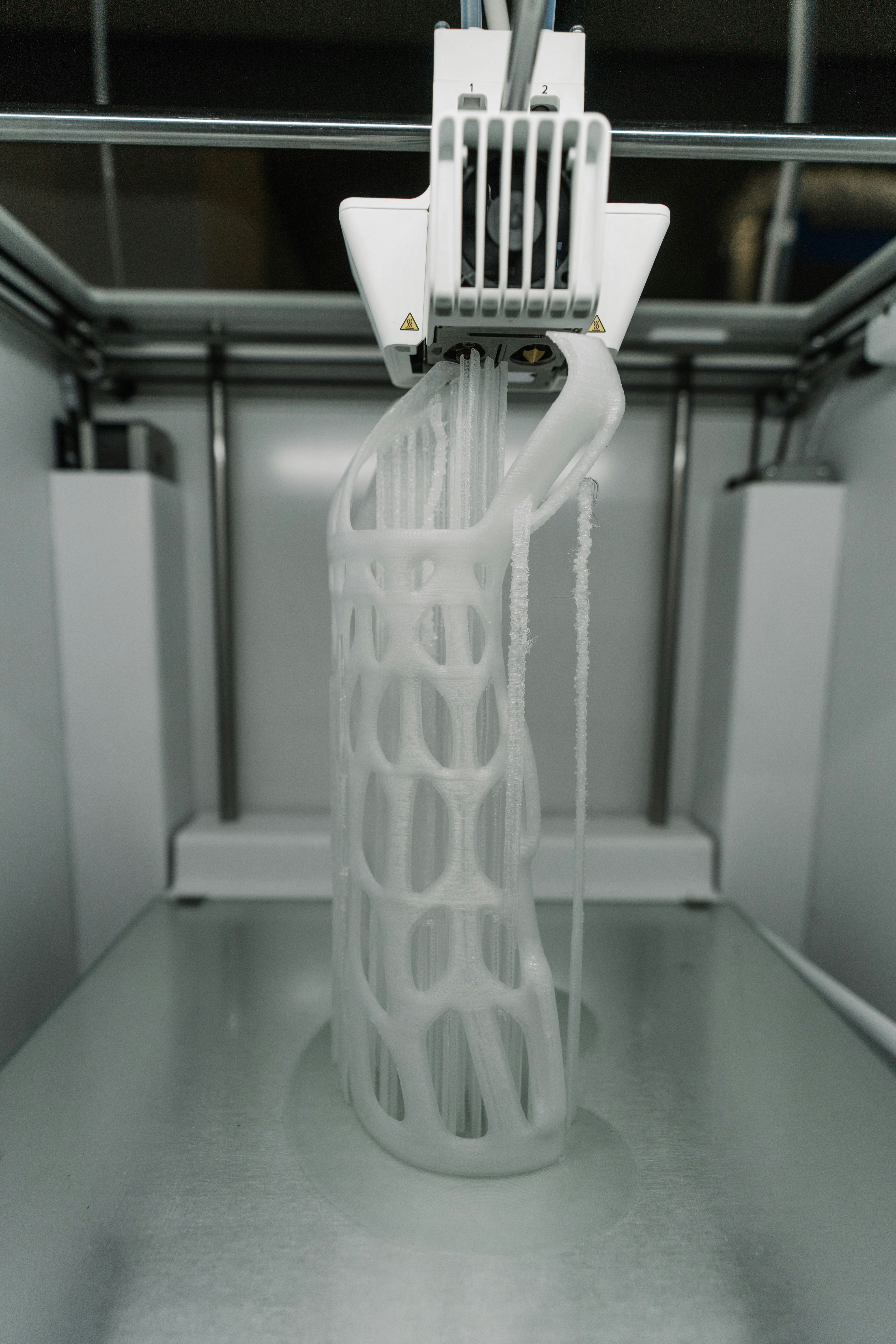 3D printer creating a white printed object layer by layer