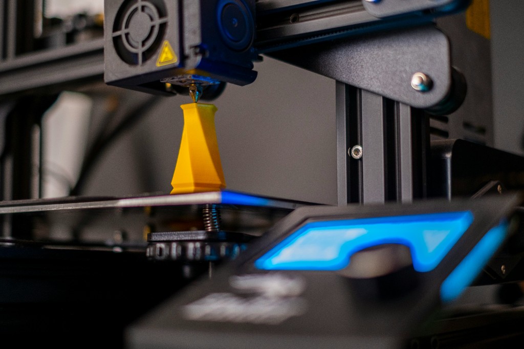 3D printer nozzle extruding filament during a print